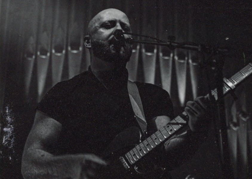 Man holding guitarx